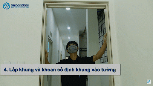Lắp khung và khoan cố định khung bao vào ô tường Lắp khung và khoan cố định khung bao vào ô tường