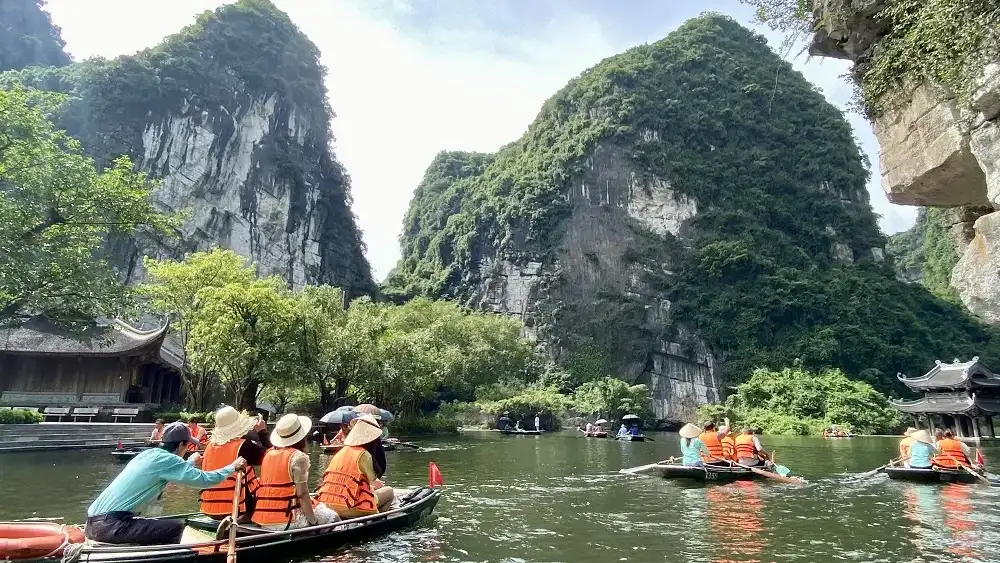 Trang An is a must-see on every Ninh Binh full day tour for its stunning river and cave views
