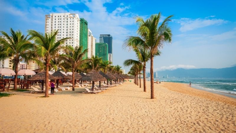 Stunning My Khe Beach in Danang Vietnam with white sand, clear water, and palm-lined shores