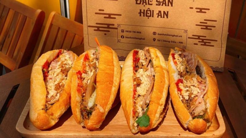 Sampling Hoi An specialties like cao lau, banh mi, and banh xeo on a food tour