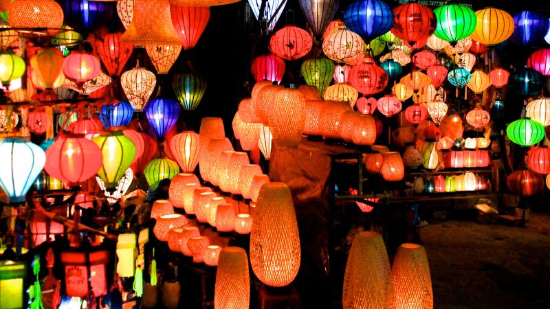 Hoi An Night Market with lanterns, souvenirs, and street food vendors