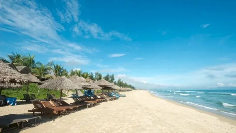 Crystal-clear water and white sandy shore at An Bang Beach, Hoi An