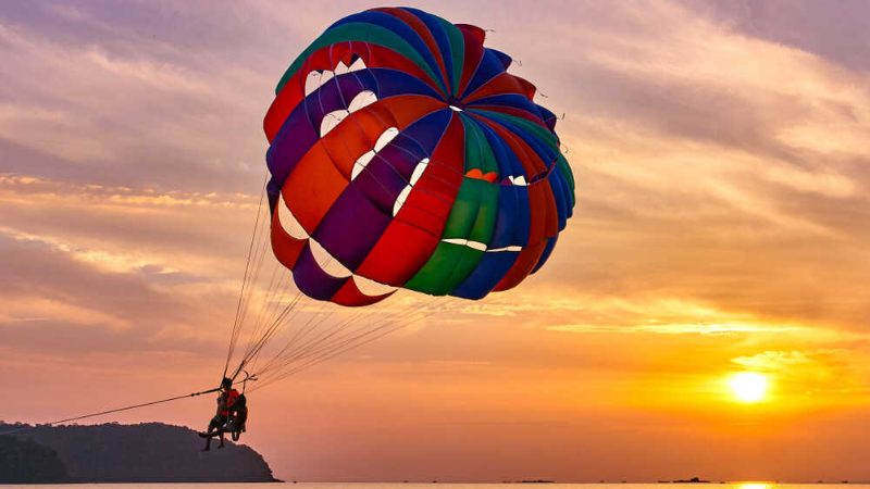 Parasailing over Da Nang’s coastline delivers thrilling moments during any adventure Vietnam travel journey