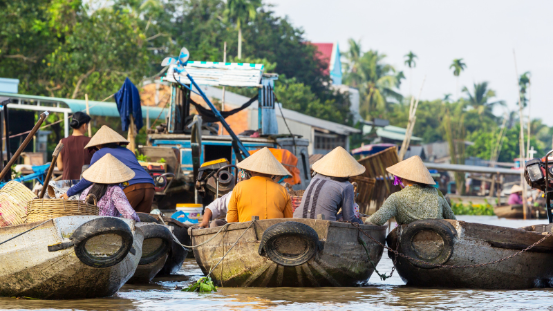 Floating market in Mekong Delta with the best travel agency in Vietnam