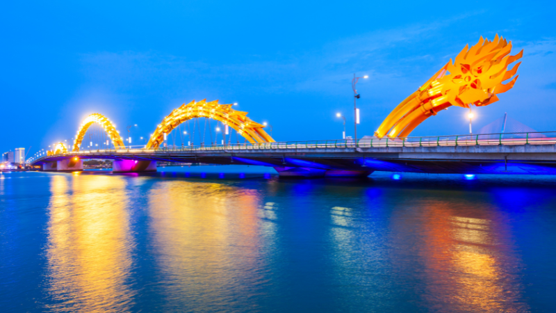 Dragon Bridge in Da Nang glowing at night with fire and water show – one of the most iconic Da Nang Vietnam attractions