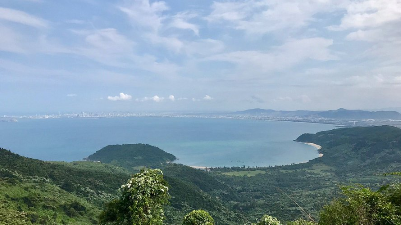 Motorbike ride on Hai Van Pass in Da Nang with ocean and mountain views, a thrilling Vietnam attraction