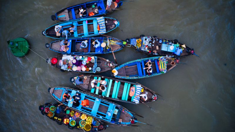 Early morning boats at Cai Rang Floating Market in Can Tho on a Ho Chi Minh to Mekong Delta trip