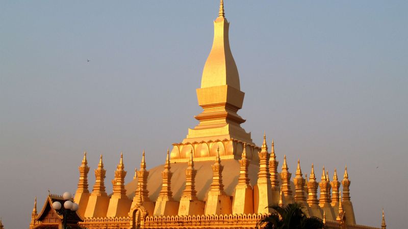 Vientiane golden That Luang stupa on Vietnam Cambodia Laos Tour from Europe
