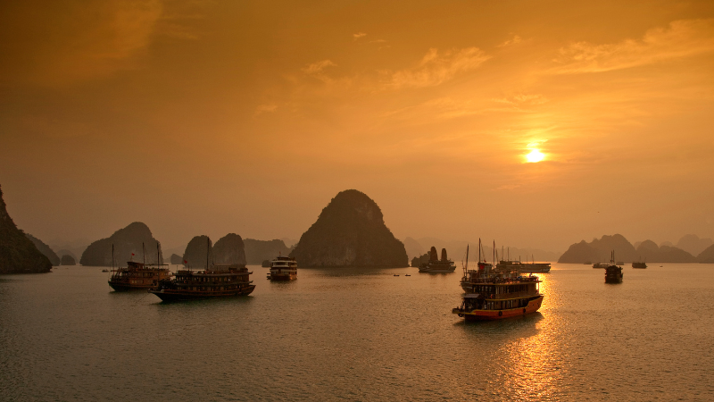 Sunset view over limestone islands during a Halong Bay cruise overnight