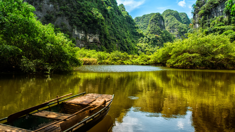 Peaceful boat ride through limestone caves in Trang An on a Ninh Binh day tour from Hanoi