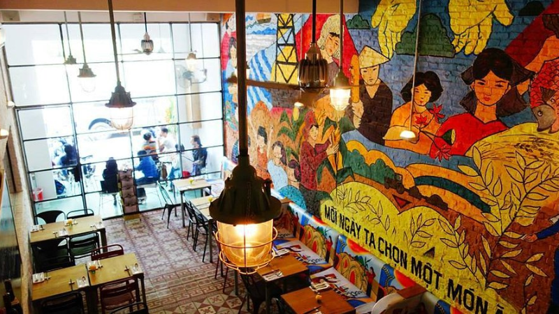 Colorful mural interior of Propaganda Vietnamese Bistro in Ho Chi Minh City