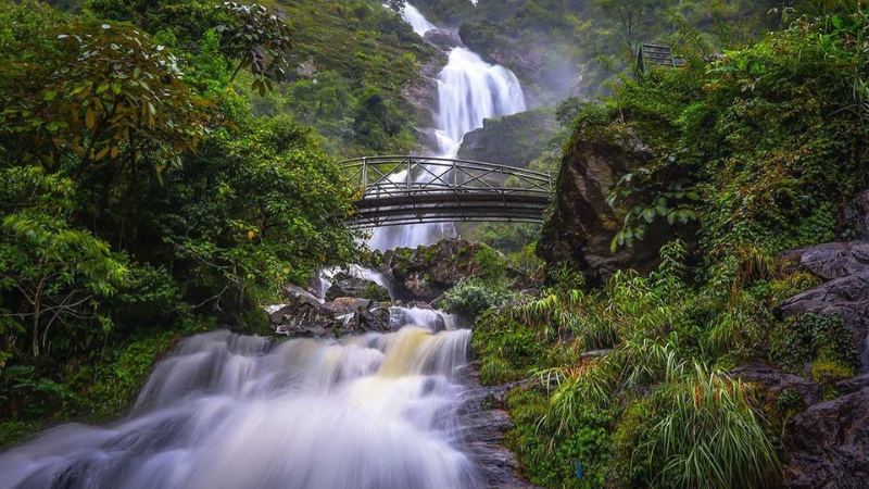 destinations to visit in Sapa Silver Waterfall with forest backdrop
