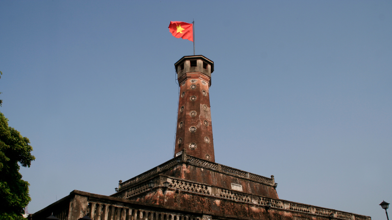 Exterior view of the Hanoi Flag Tower with the national flag flying on top