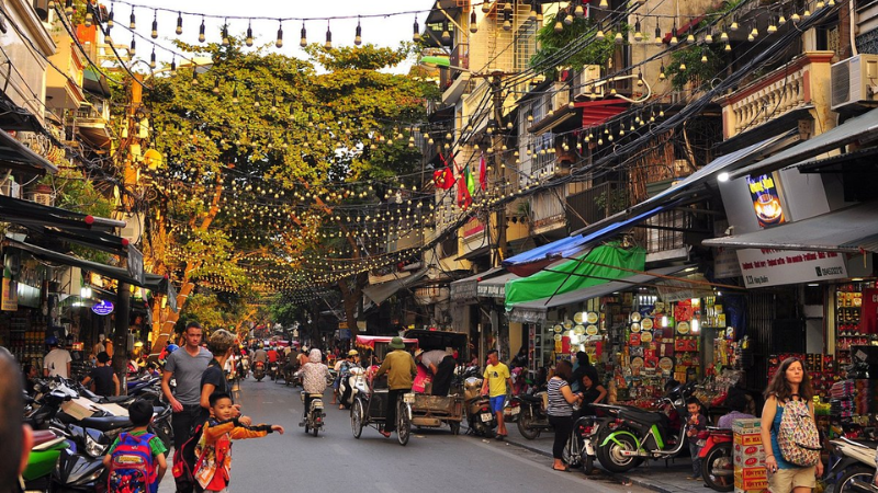 Hang Dao Street in Hanoi Old Quarter with crowds and historic buildings