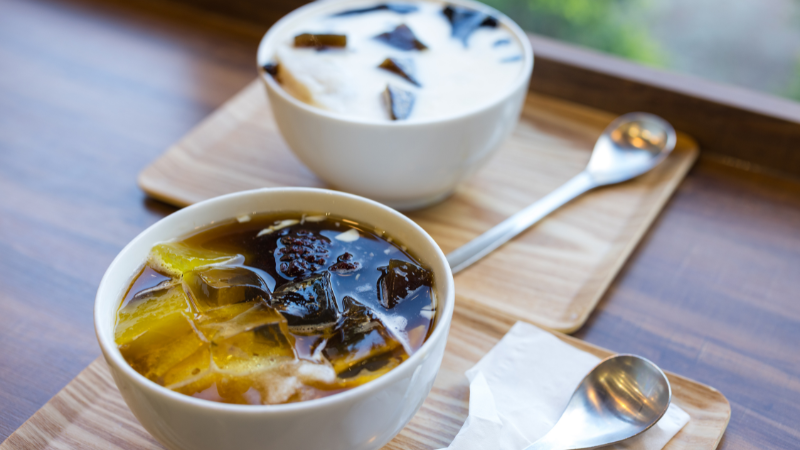 Hanoi Street Food Tour: A Flavorful Journey Through the Capital’s Best Local Eats 4 Bowl of Hanoi tofu pudding topped with syrup and coconut